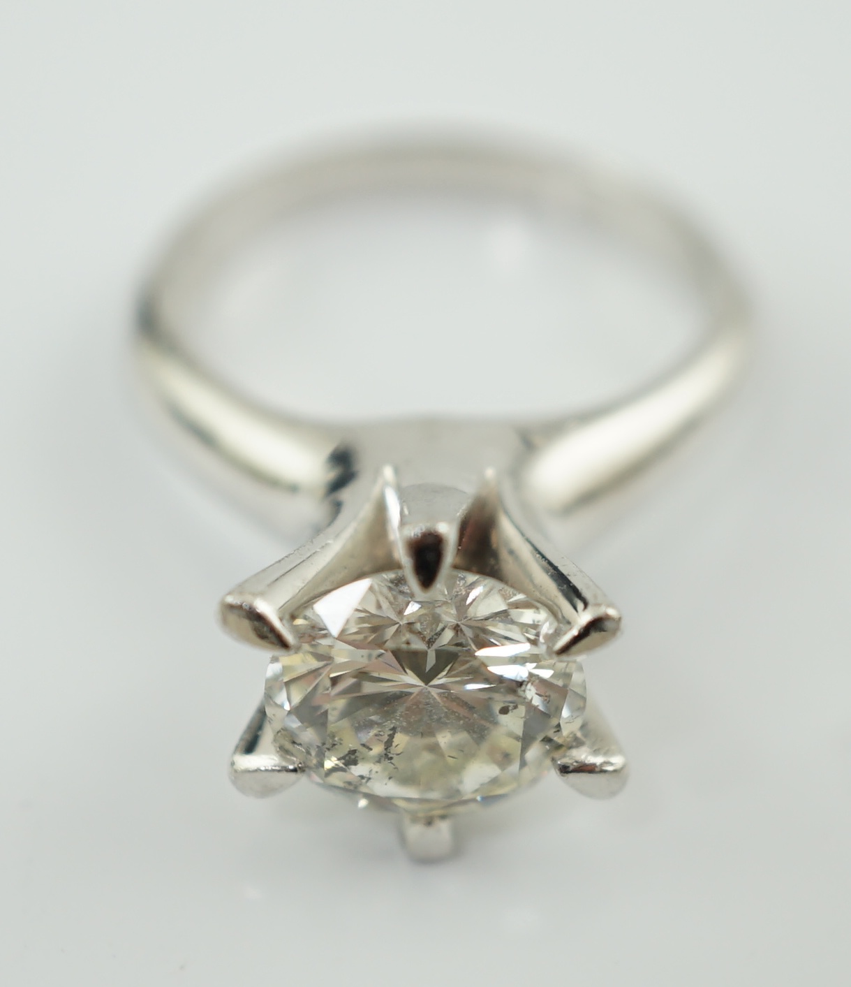A modern platinum and solitaire diamond set ring